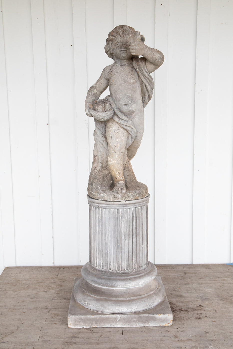 Concrete Cherub on wooden plinth