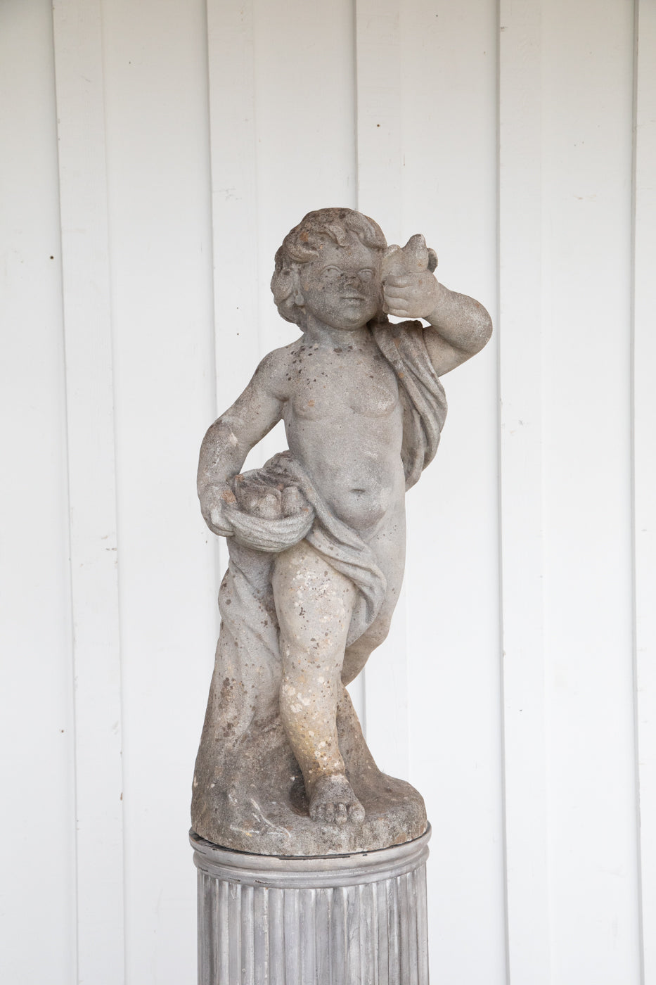 Concrete Cherub on wooden plinth